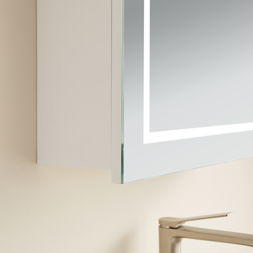Close-up of a modern door handle on a glass door with a neutral background