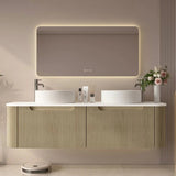 Modern bathroom vanity with illuminated mirror and decorative elements.