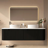 Modern bathroom vanity with illuminated mirror and decorative elements.