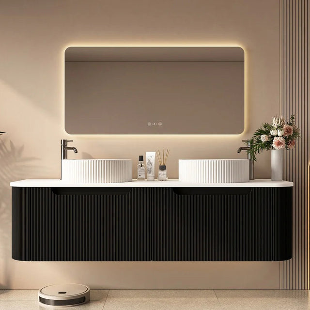 Modern bathroom vanity with illuminated mirror and decorative elements.