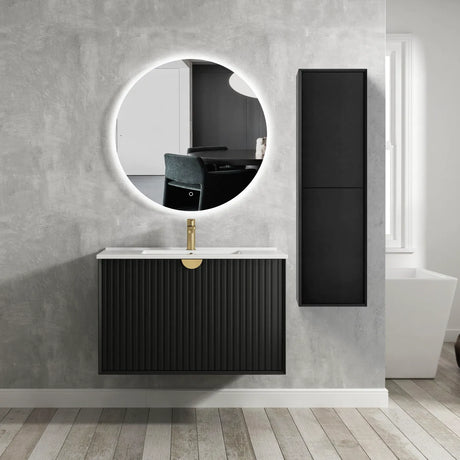 Bathroom with black vanity unit, round mirror, and tall black cabinet.