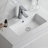 Bathroom sink with chrome faucet on a white countertop