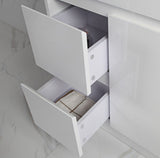 White cabinet with open drawers on a light gray background