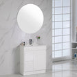 Bathroom vanity with round mirror against a marble wall