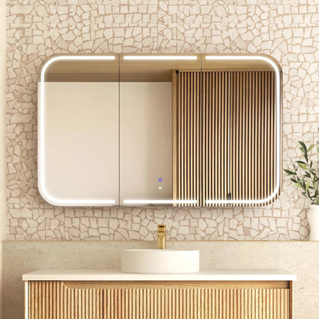 Bathroom vanity with a mirror and mosaic tile wall
