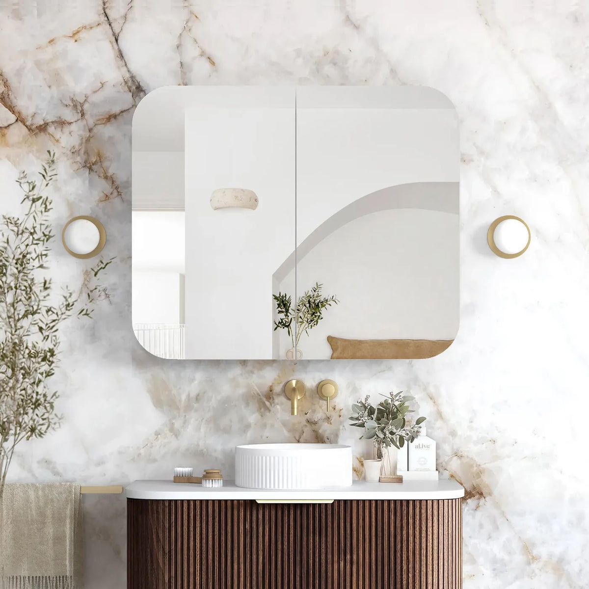 Bathroom with marble wall, vanity, and decorative elements
