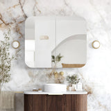 Bathroom with marble wall, vanity, and decorative elements