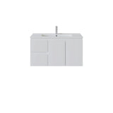 A modern left hand white bathroom vanity cabinet with an integrated sink and a tall, slim chrome faucet, shown against a plain white background