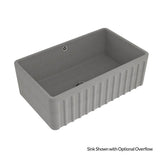 Gray rectangular sink with ribbed design on a white background