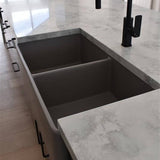 Modern kitchen sink with black faucet on a marble countertop