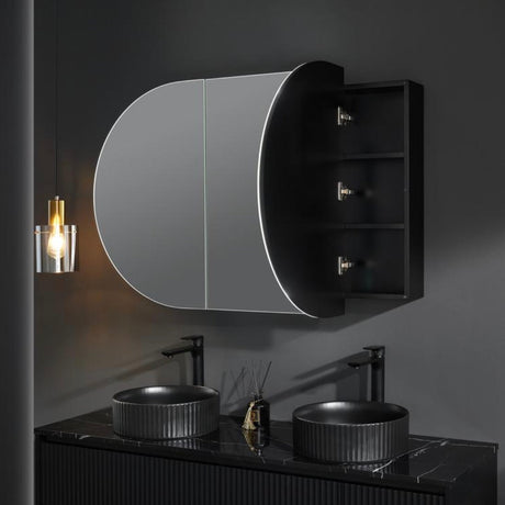 Bathroom setup with black vanity, round sinks, and a mirror on a dark wall.