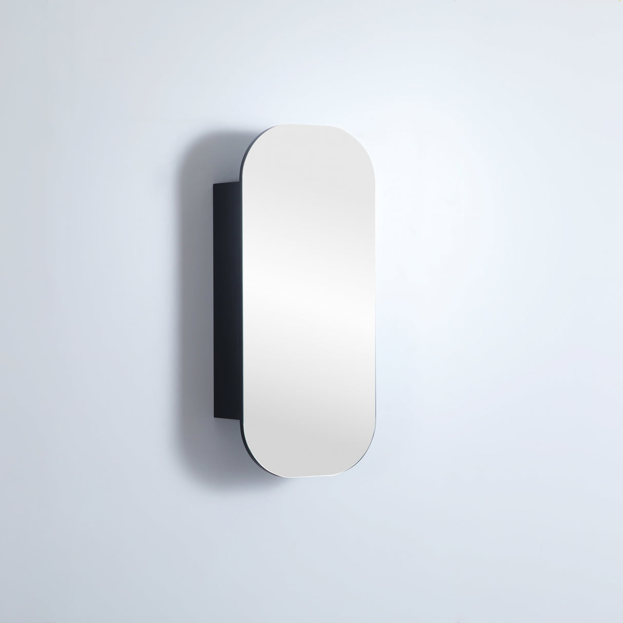 Rectangular mirror with black frame on a light gray background