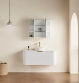 Bathroom setup with a white vanity, sink, and mirror cabinet against a beige wall.