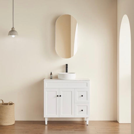 room with oblong shape mounted shaving cabinet with free standing vanity