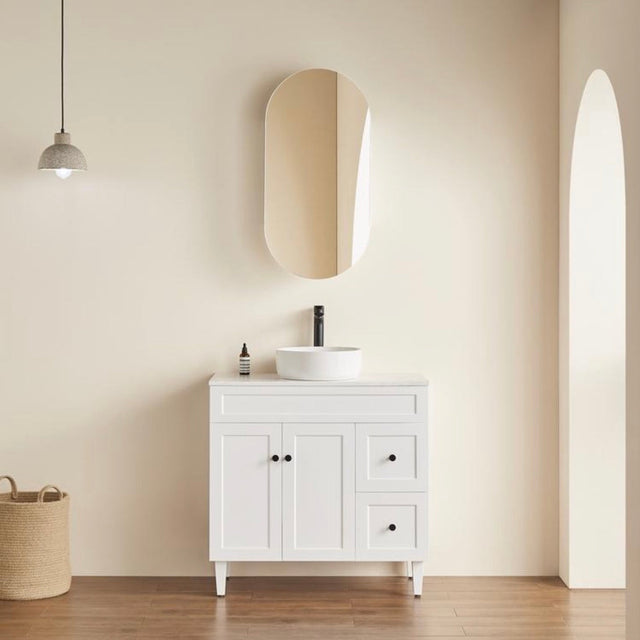 room with oblong shape mounted shaving cabinet with free standing vanity