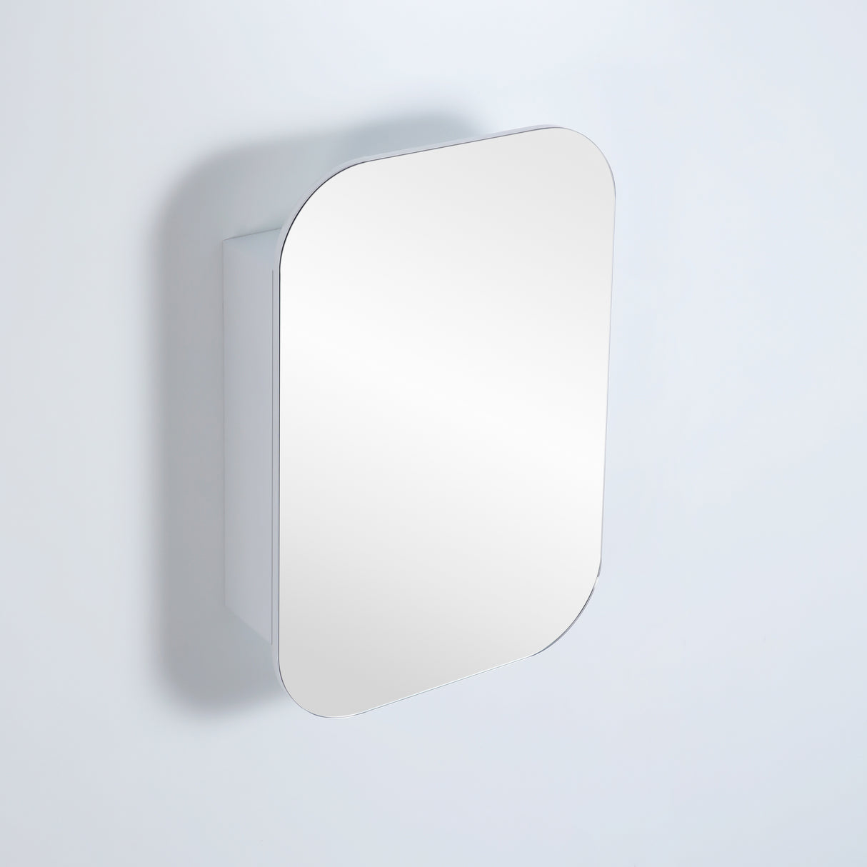 closed rectangular white shaving cabinet in grey wall