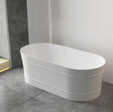 White freestanding bathtub in a modern bathroom setting