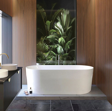 Modern bathroom with a freestanding bathtub, black vanity, and large window with plant view.