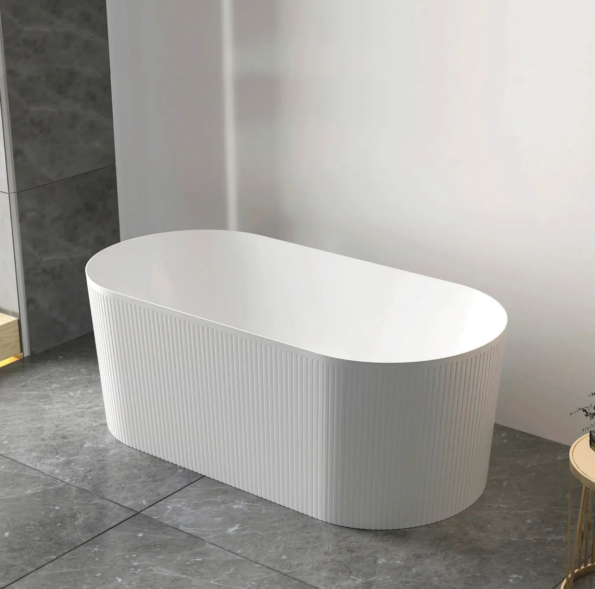 White freestanding bathtub in a modern bathroom setting