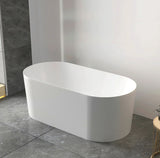 White freestanding bathtub in a modern bathroom setting