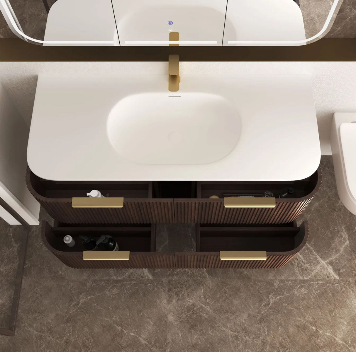 Bathroom vanity with white sink and brown drawers, featuring gold fixtures.