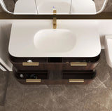 Bathroom vanity with white sink and brown drawers, featuring gold fixtures.