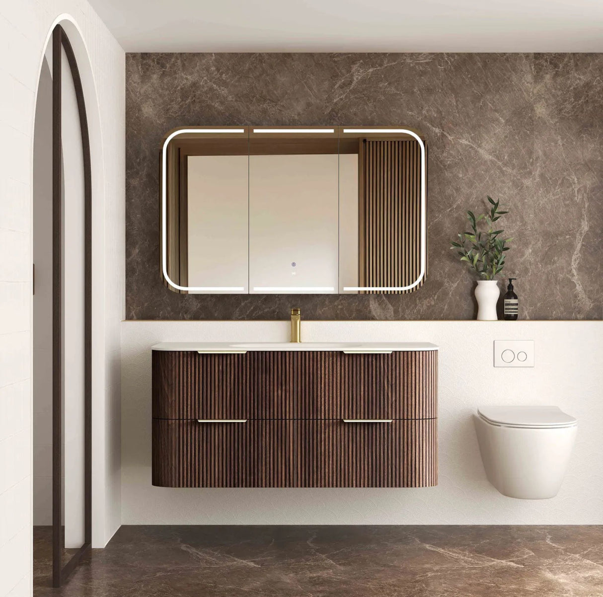 Modern bathroom with wooden vanity, mirror, and toilet against a marble wall.