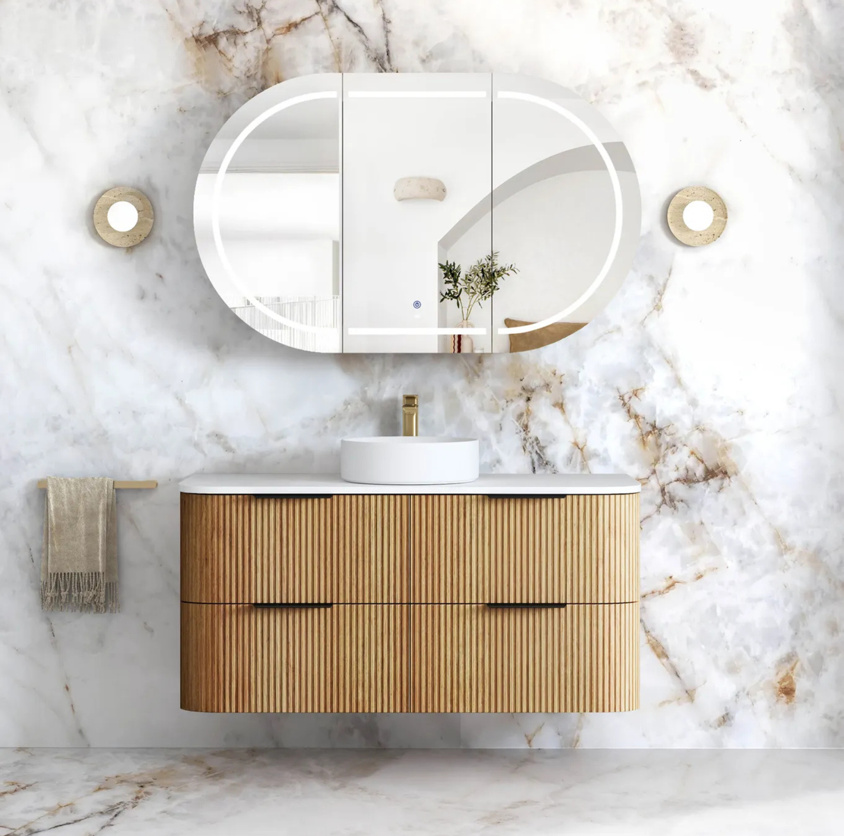Bathroom vanity with wooden cabinet, round mirror, and marble wall.