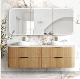 Bathroom vanity with wooden cabinet, double sink, and large mirror on a marble wall.