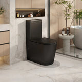 Modern black toilet in a stylish bathroom with marble walls and a bathtub.