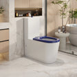 Modern bathroom with a white toilet and blue seat cover.