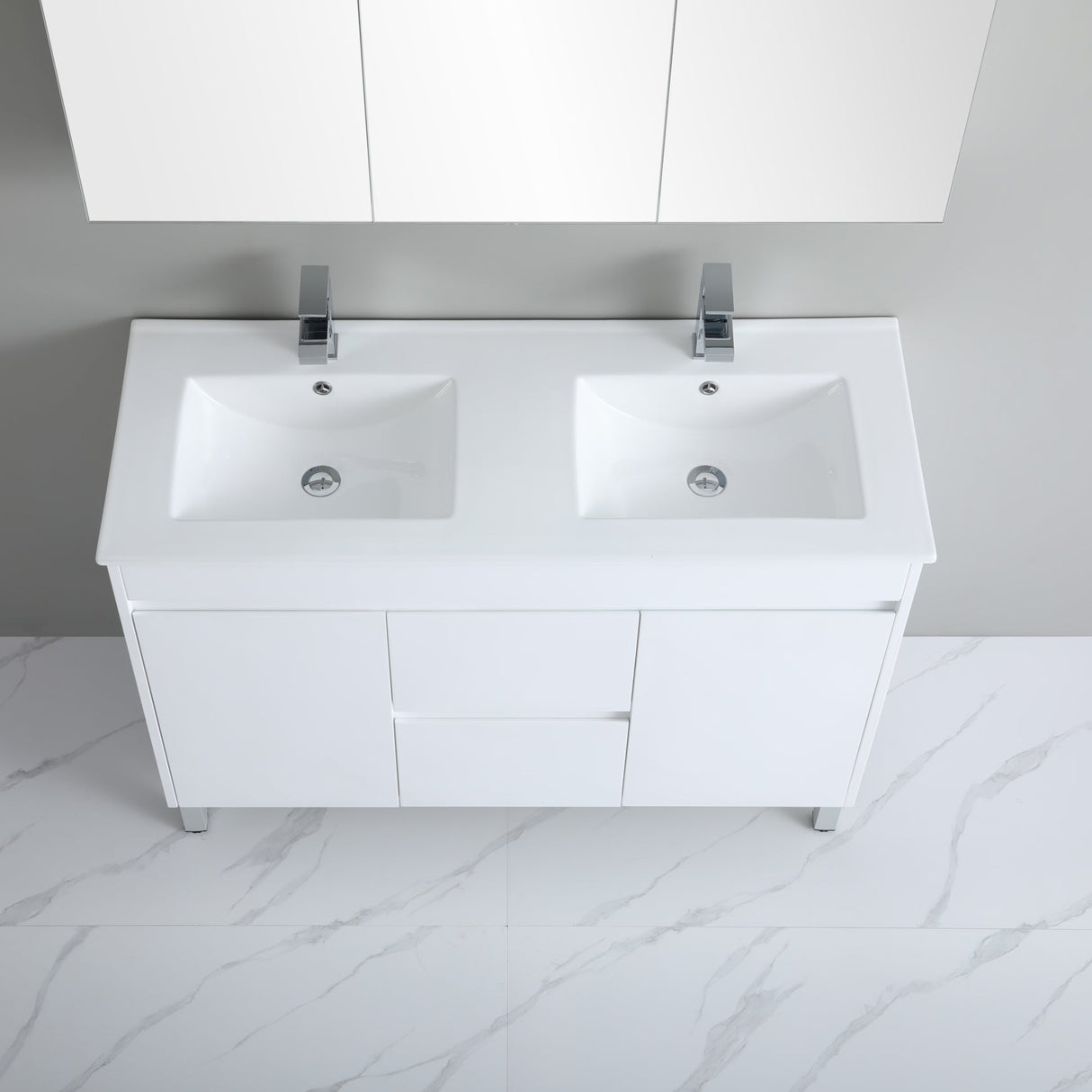White bathroom vanity with double sink and cabinets in a modern bathroom setting.