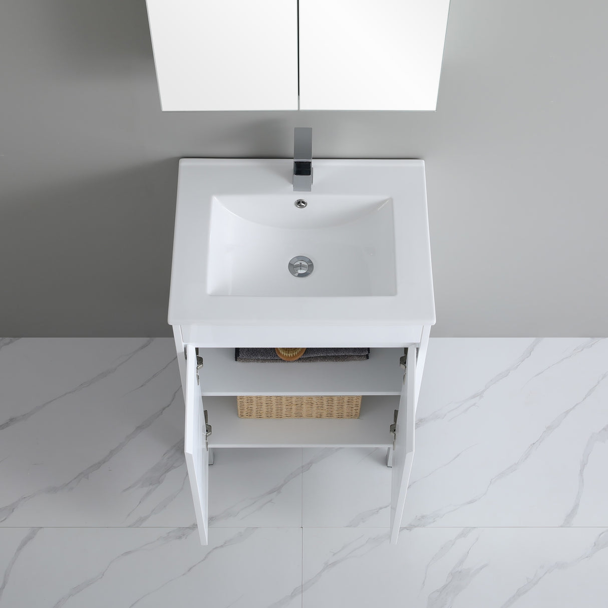 White bathroom vanity with sink against a gray wall