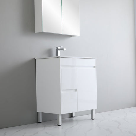 White bathroom vanity with a sink against a gray wall.