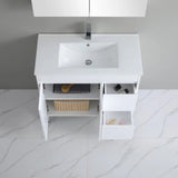 White bathroom vanity with sink on a tiled floor