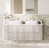 Bathroom vanity with two sinks and a mirror above, featuring a neutral color scheme.
