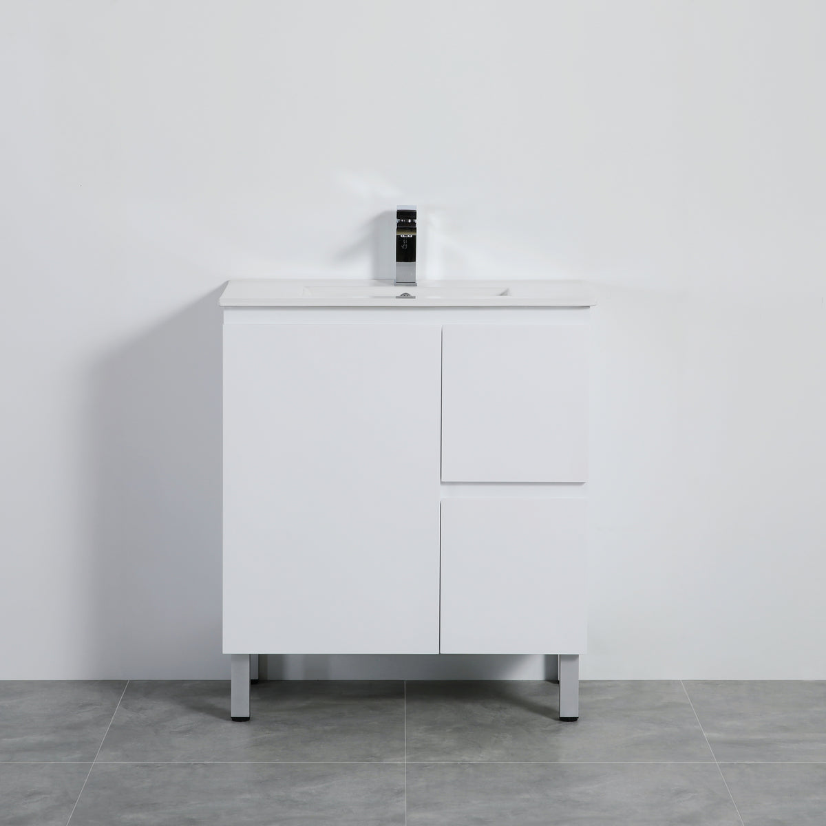 White bathroom vanity with sink against a gray wall
