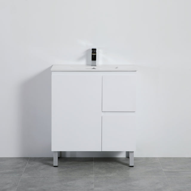 White bathroom vanity with sink against a gray wall