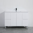 White bathroom vanity with a mirror on a gray floor and white wall