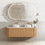 Bathroom vanity with wooden cabinet, two sinks, and a large mirror with LED lighting.