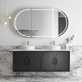 Bathroom vanity with black cabinet, white countertop, and round mirror with lights.