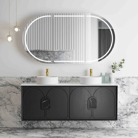 Bathroom vanity with black cabinet, white countertop, and round mirror with lights.