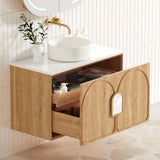 Bathroom vanity with open drawer, sink, and decorative elements.