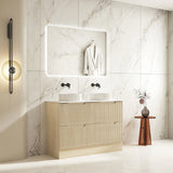 Bathroom with wooden vanity, mirror, and light fixture.