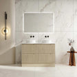 Bathroom vanity with mirror and lighting fixture against a marble wall.