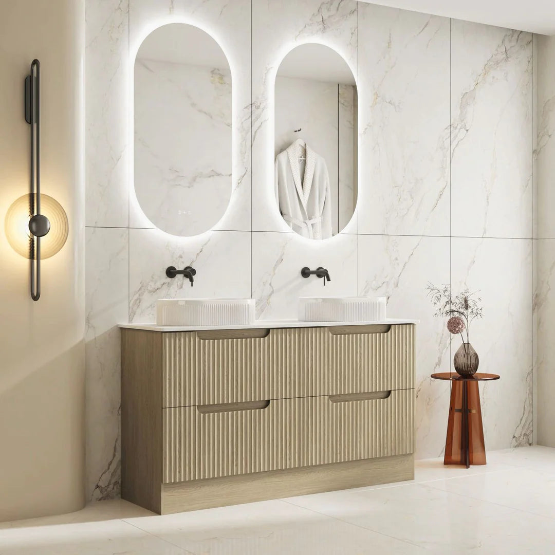 Bathroom vanity with two sinks, mirrors, and decorative elements in a modern setting.