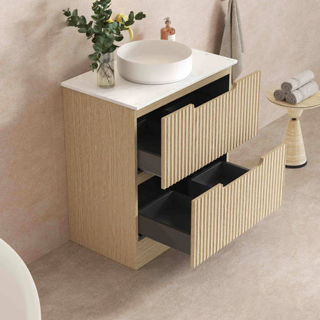 Bathroom vanity with white countertop and wooden cabinet, featuring a sink and decorative elements.