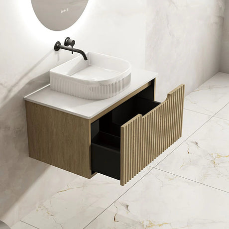Bathroom vanity with sink and open drawer on a tiled floor