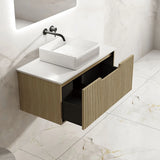 Bathroom vanity with sink and open drawer on a tiled floor
