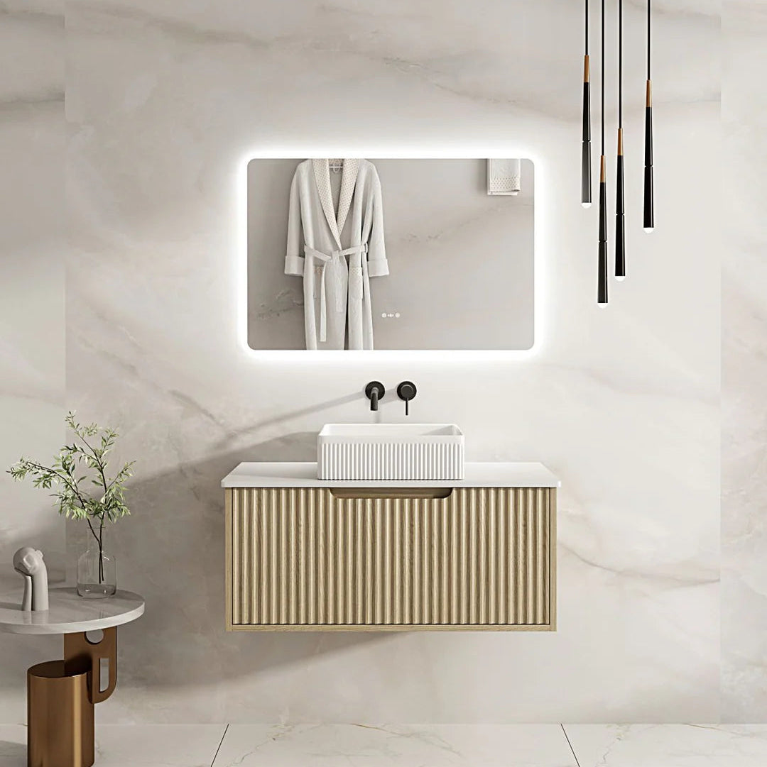 Modern bathroom with a vanity unit, mirror, and hanging robe.